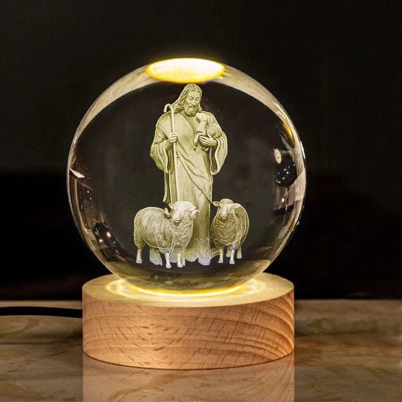 White crystal ball desk ornament with wood base and religious design inside