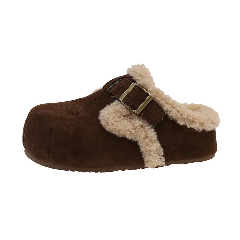 Baotou semi-drag fleece slippers in brown and camel with faux fur lining, closed toe, and rubber sole on a wooden floor