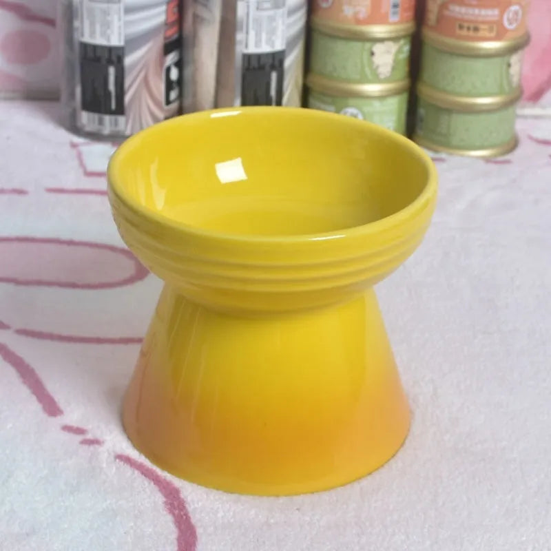 Black ceramic pet bowl with a high foot and neck protector to prevent tipping, shown with flat and slanted rim options.