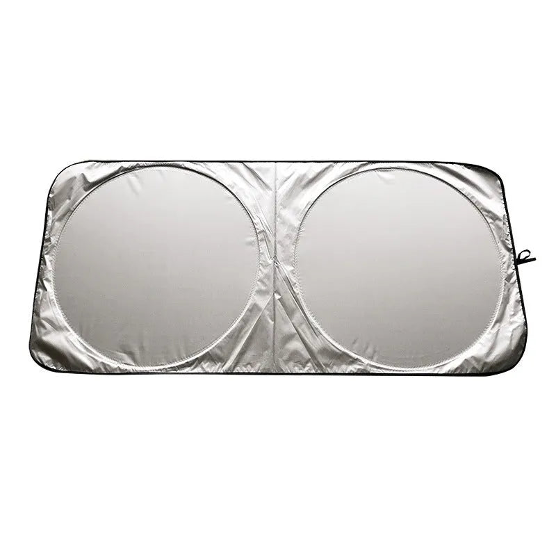 Silver tape car sunshade in 190x90cm size laid against a car windshield
