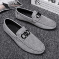 Men's summer breathable casual shoes in black with suede upper and rubber sole on a light background