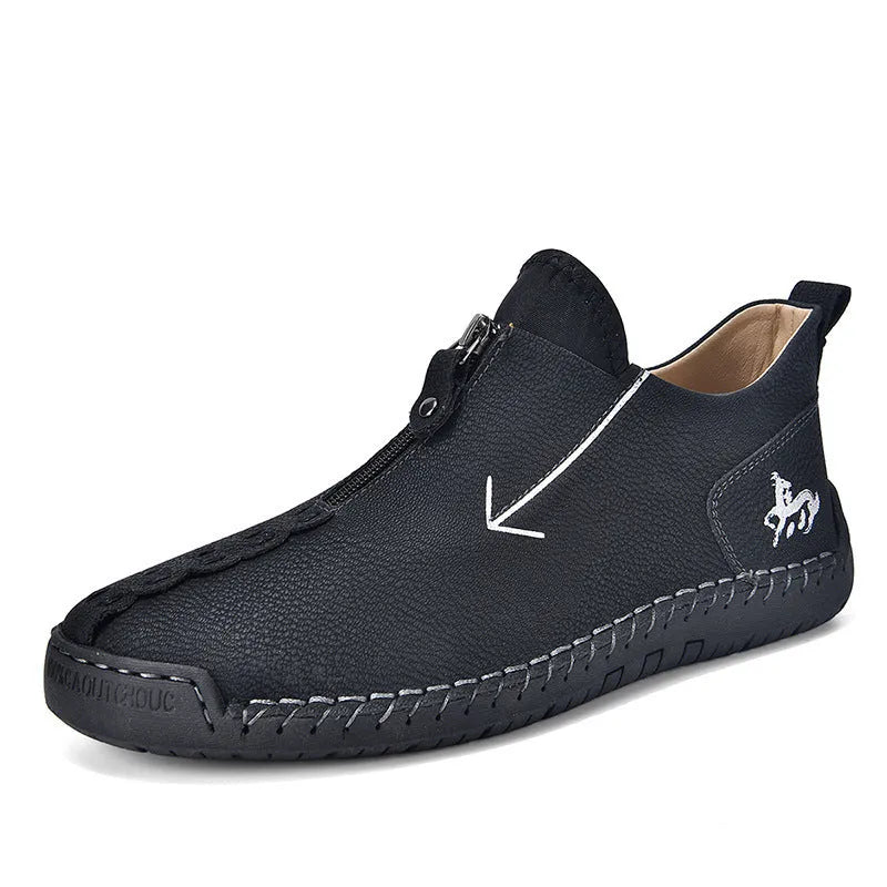 Men's black leather martin boots with a front zip, round toe, and hand-stitched seams on a rubber sole.