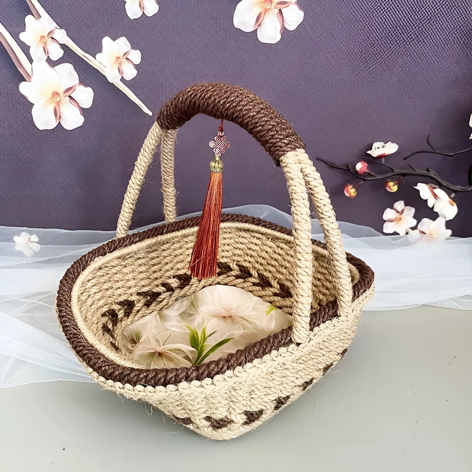 Hand-woven hemp rope basket in natural brown colour measuring 19cm high by 12cm wide