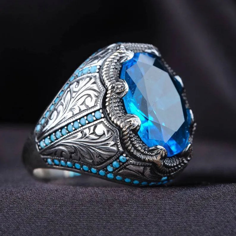 Geometric antique silver alloy ring with blue zircon stone showing European American styling