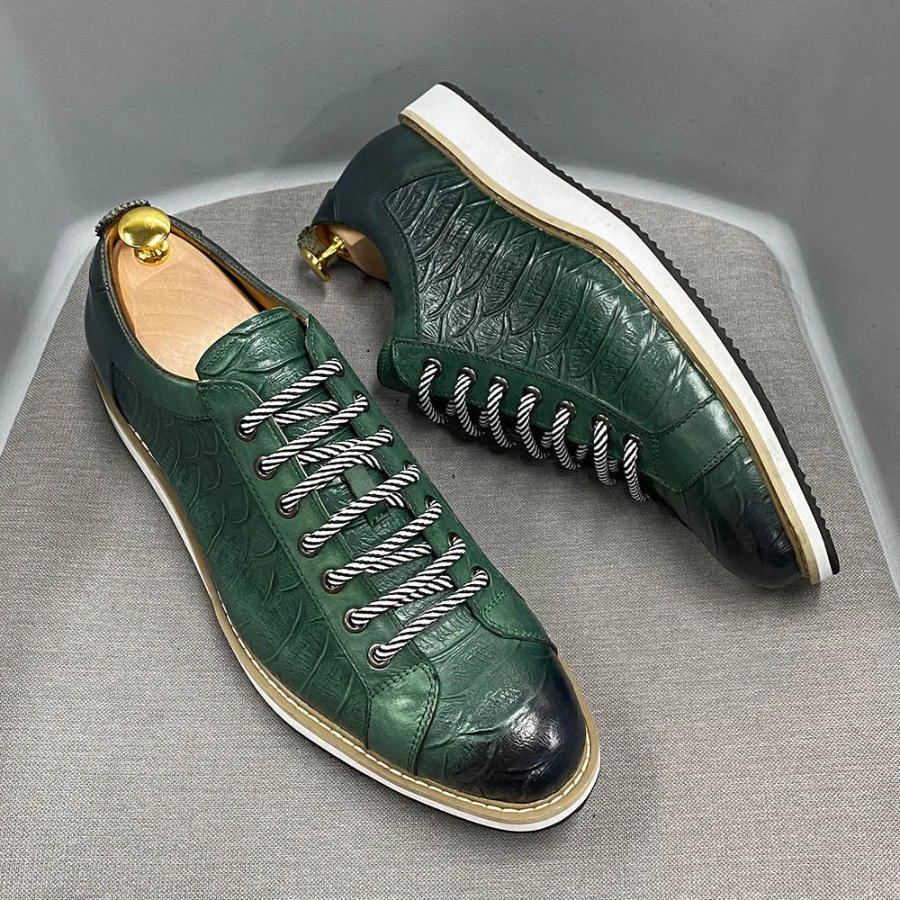 Handmade men's low-cut shoes with an embossed pattern and front-tie lacing.