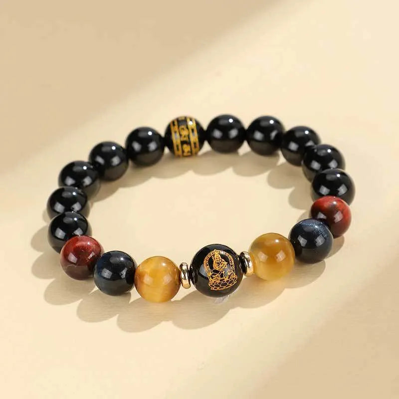 Handmade black agate beaded bracelet with Buddhist carving and tiger eye gemstones