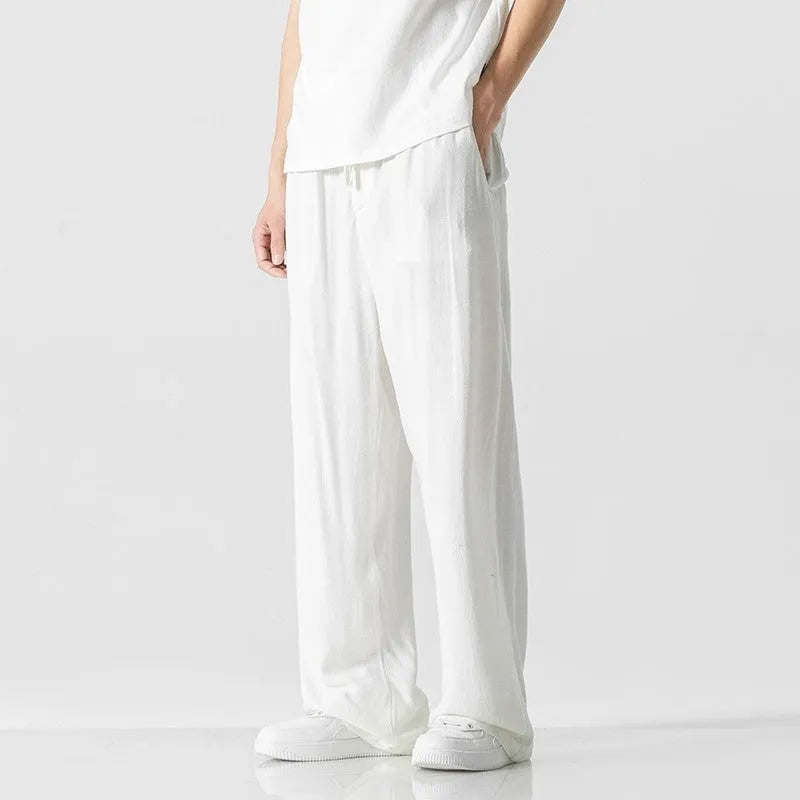 Men's straight-leg casual trousers in beige bamboo fibre fabric with a drawstring waist.