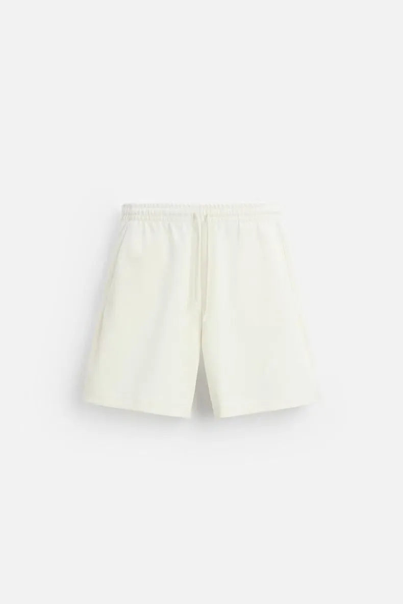 Loose double-sided cloth texture short sleeve top and matching shorts set on a hanger.