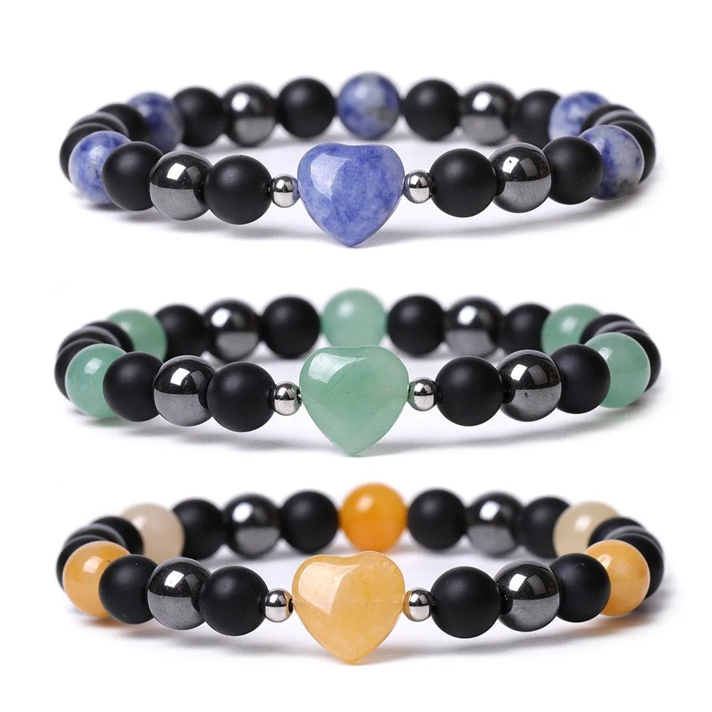 Hand-cut peach heart stone bracelet with geometric universe and moon design in various colours.