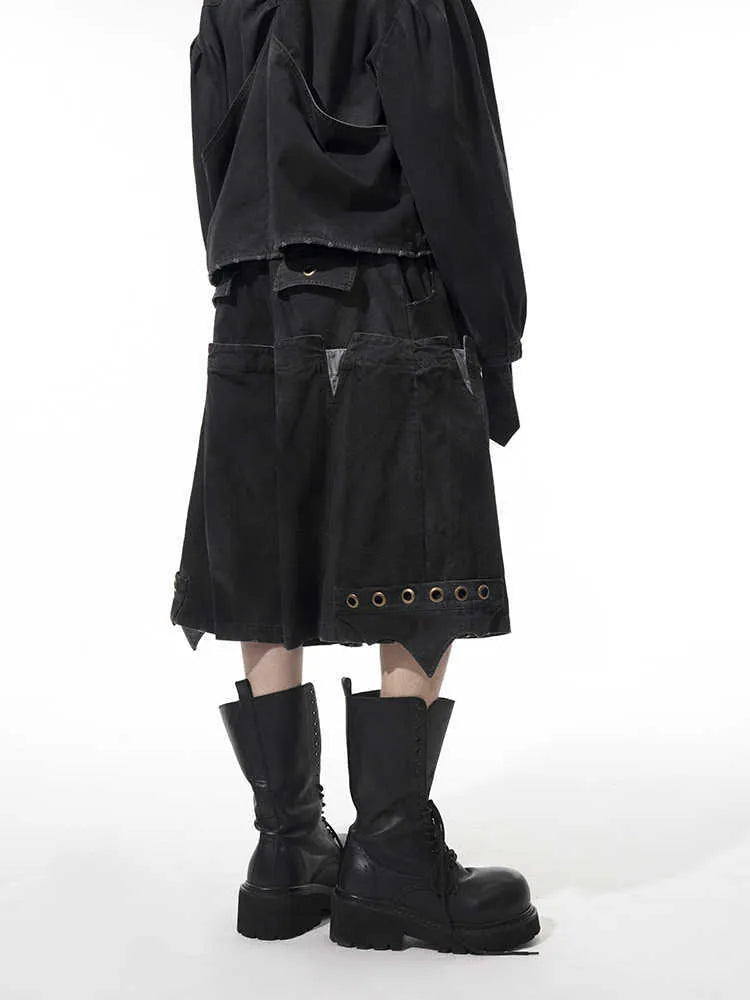 Men's black loose cropped trousers showing double waistband and washed stitching detail