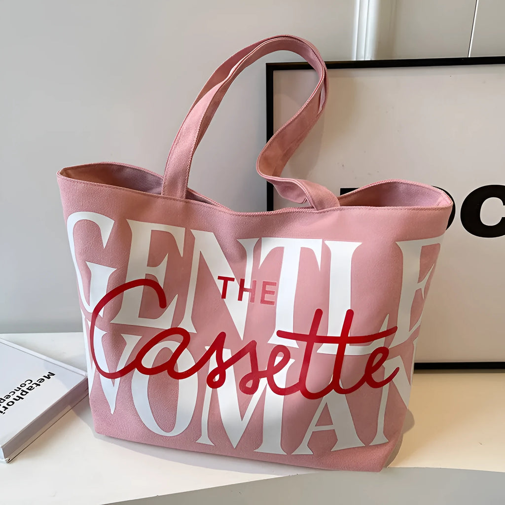 Letter printed canvas tote bag in off white with car stitching detail and top handles