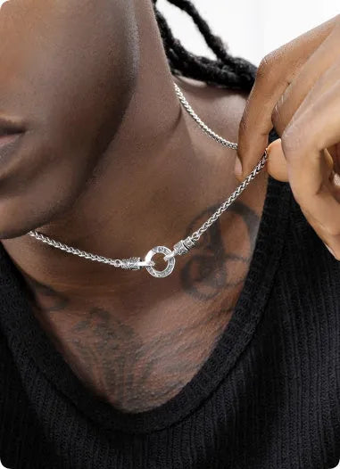 A woman's S925 sterling silver clavicle necklace with a small polished pendant on a choice of 50cm, 55cm, or 60cm chain.