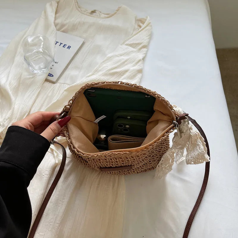 Women's woven straw messenger bag with hollowed design and single shoulder strap in khaki colour
