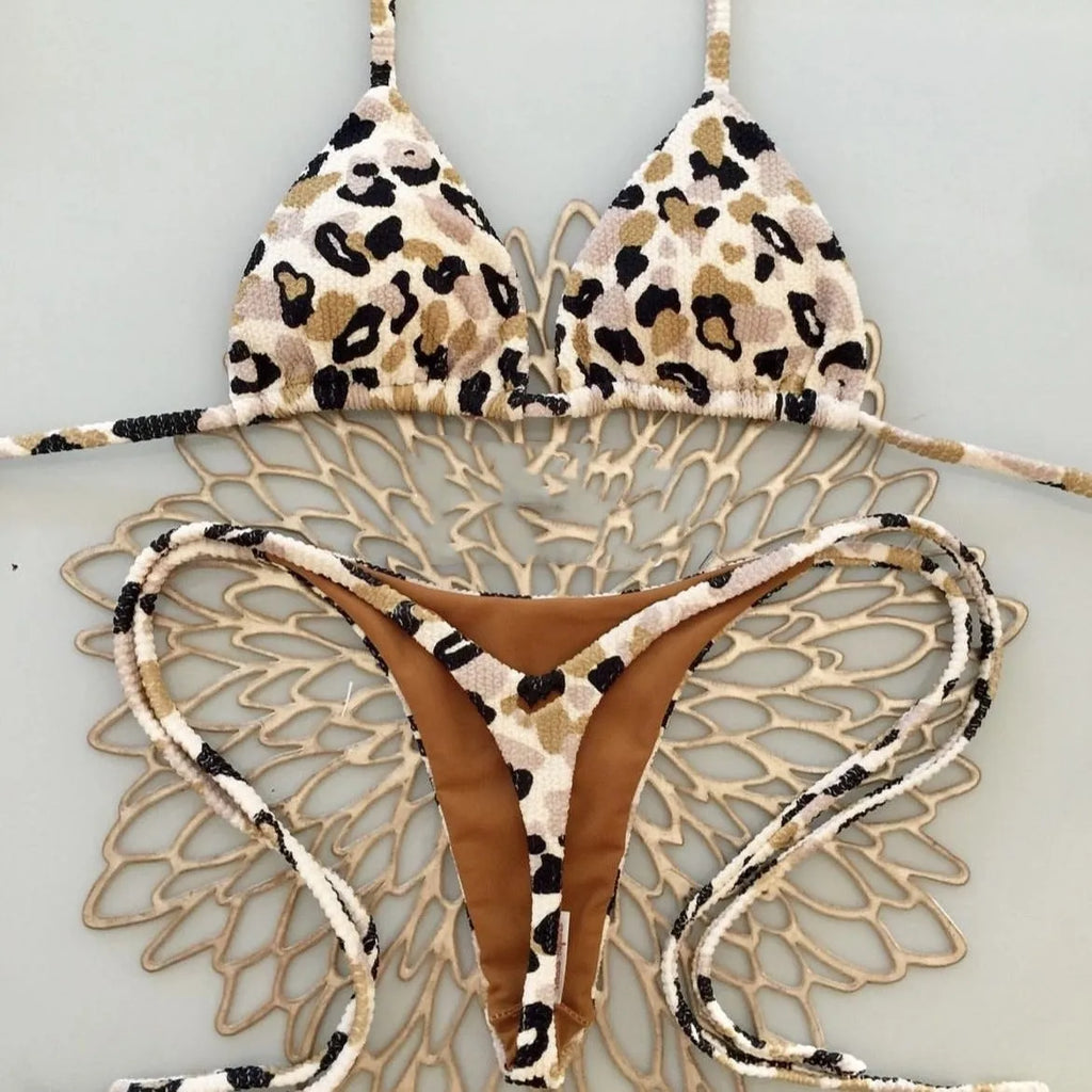 Women's printed nylon bikini with briefs style and cotton lining for swimming sports.