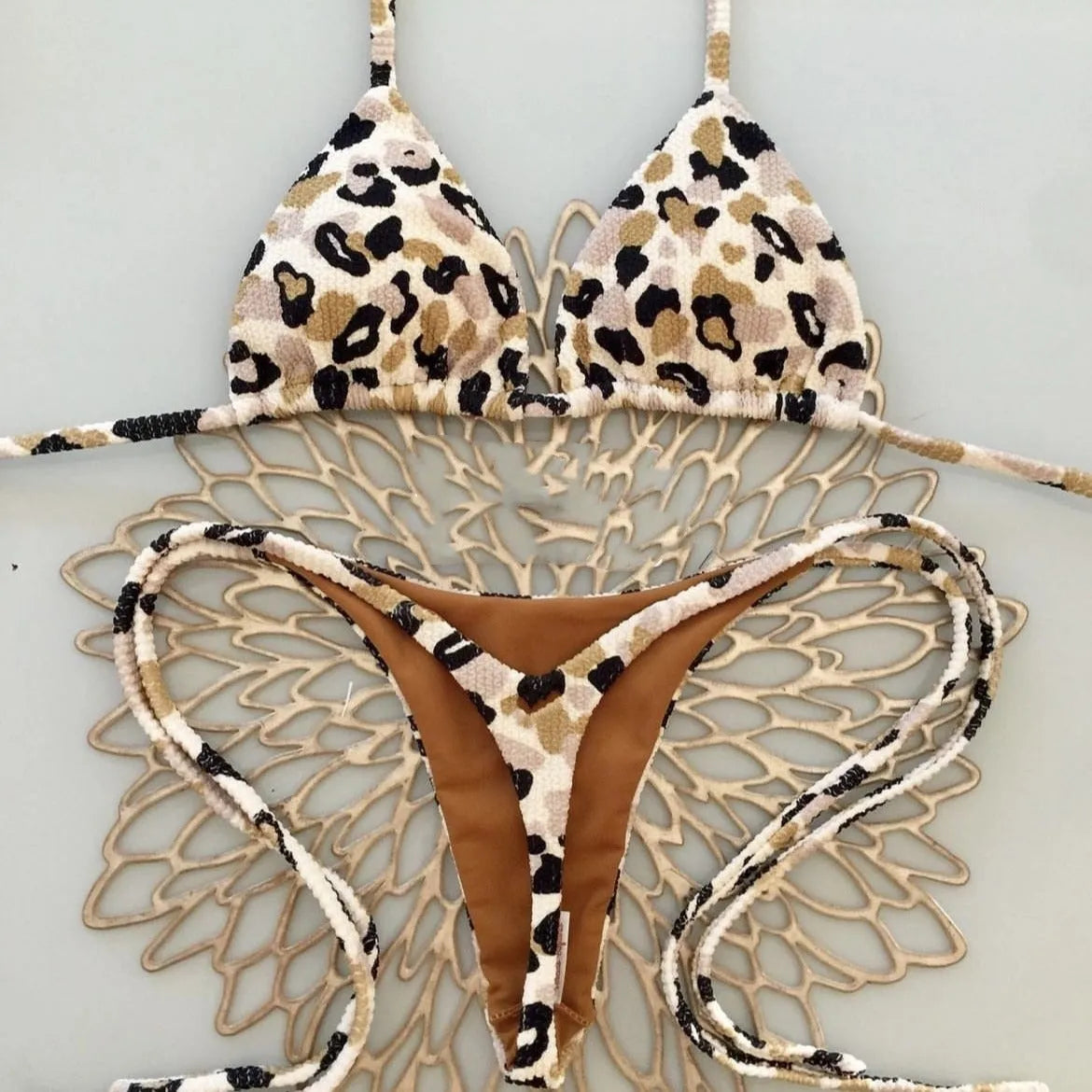 Women's printed nylon bikini with briefs style and cotton lining for swimming sports.