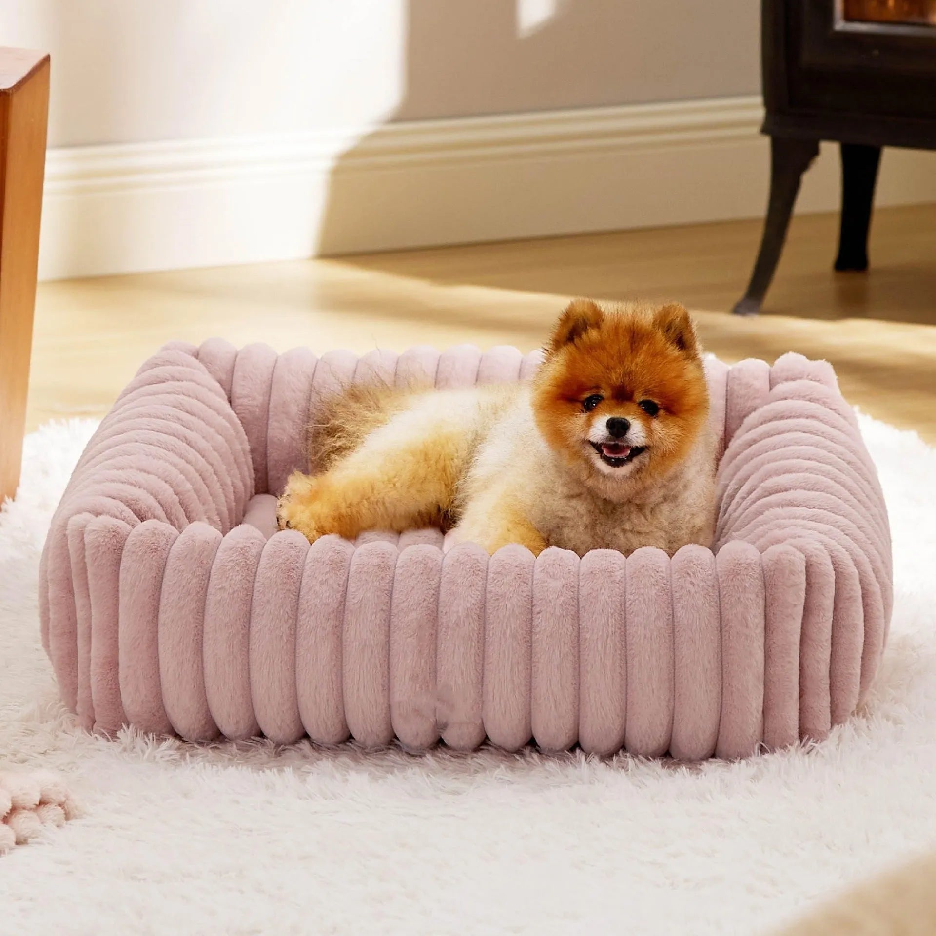 Rectangular orthopaedic dog bed with raised edges in beige colour showing high-density foam filling
