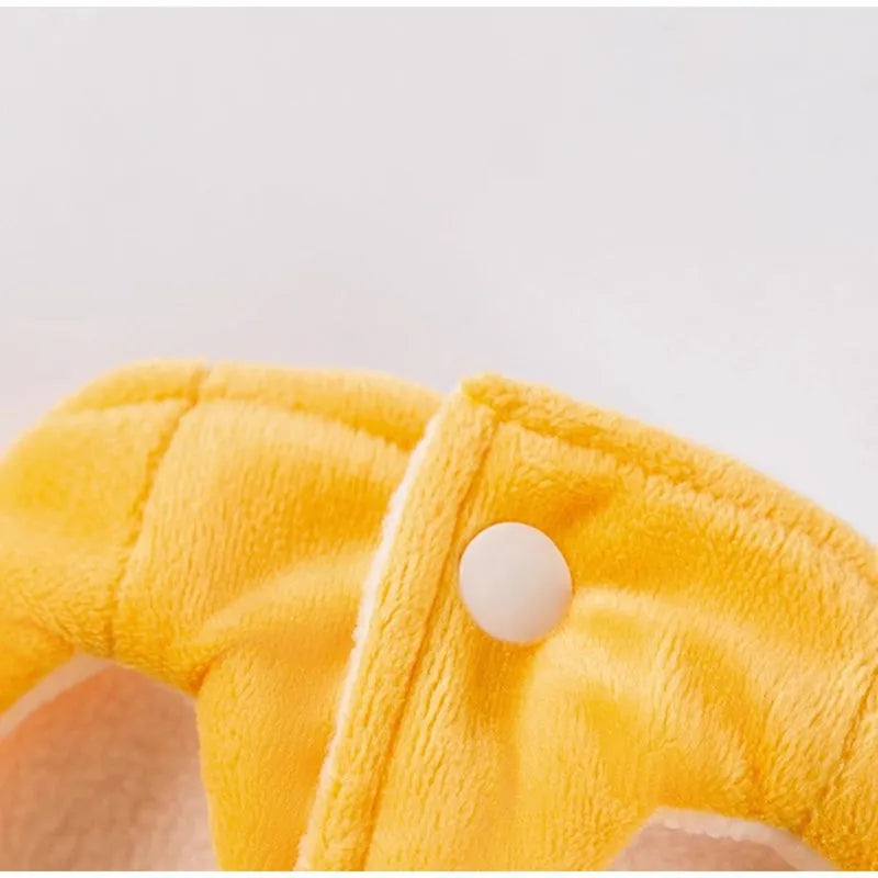 Yellow onsen fish pet costume with fish-shaped hat and vest on a dog with leash ring