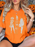 Loose short-sleeve cotton T-shirt on a hanger, showing round neckline, available in black, green, grey, and orange.