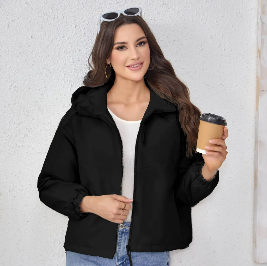 Women's grey loose-fit hooded polyester shell jacket with long sleeves.