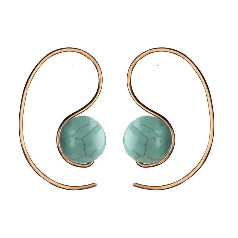 Green turquoise retro style dangle earrings with blue turquoise centrepiece on a white background