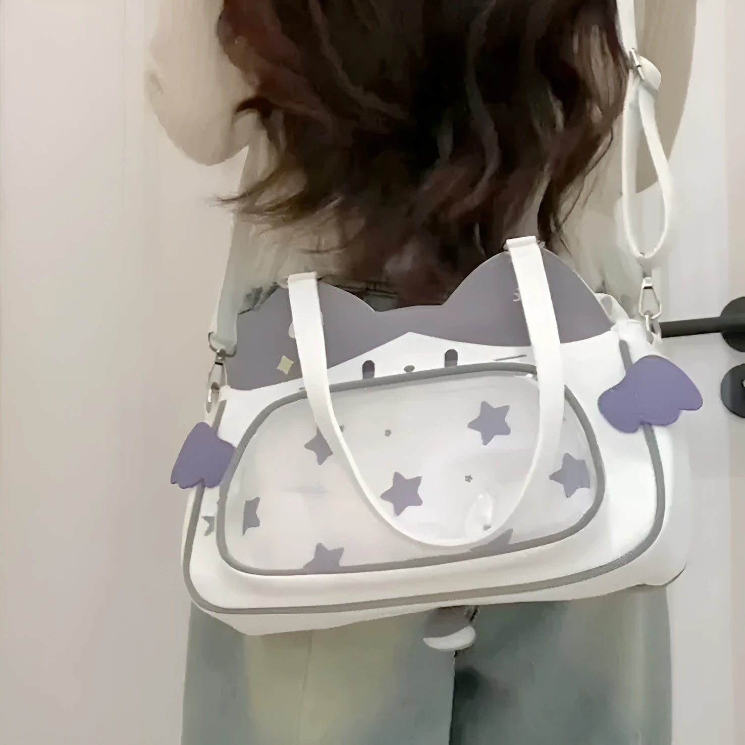 Horizontal cartoon owl pin PU crossbody bag in black, side view showing stitching and single strap