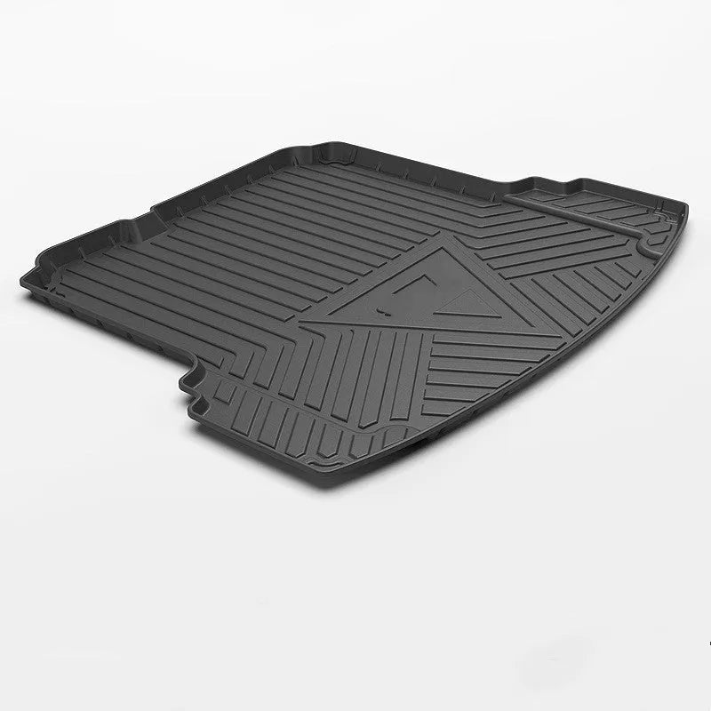 Black carbon fibre pattern TPE car boot liner mat for vehicle trunk protection.