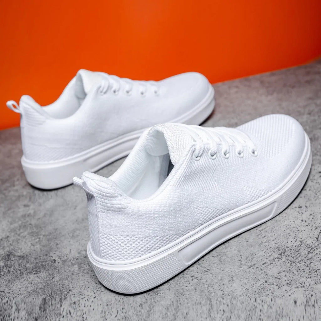 Light white and black unisex casual board shoes with mesh upper and thick EVA sole.