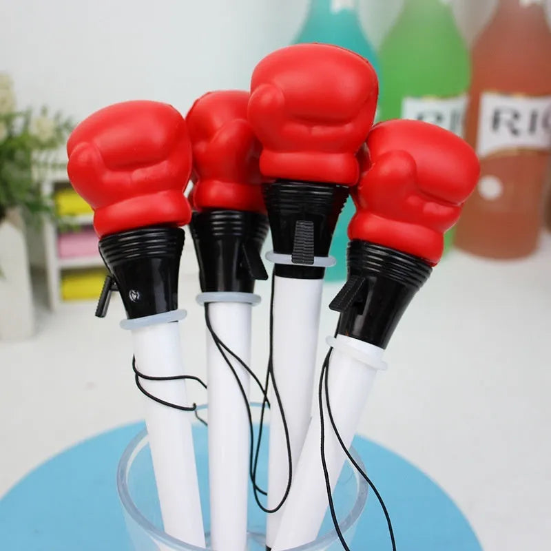 Four black pressure relief boxing press ejection pens with plug-in sleeve mechanisms on a desk.