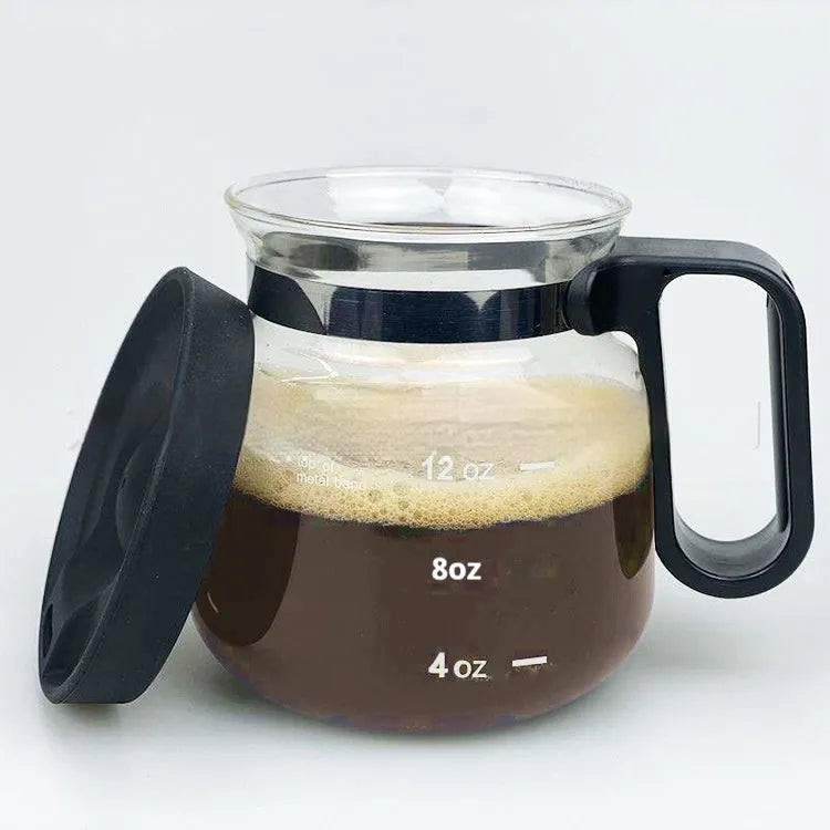 Transparent borosilicate glass coffee maker with silicone cover on a kitchen countertop, 355-473ml capacity