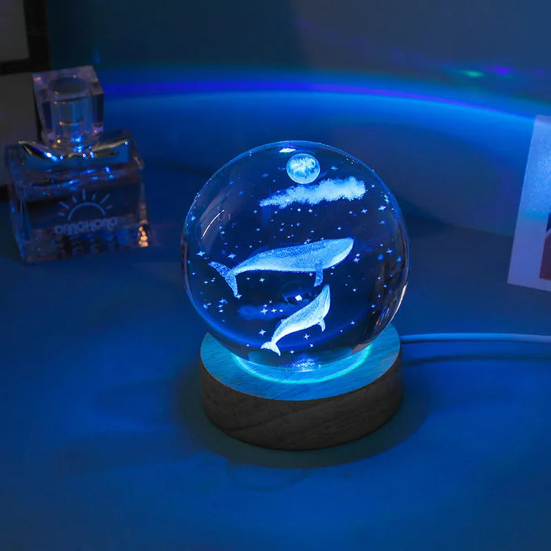Colorful luminous crystal ball on light wooden base with data cable