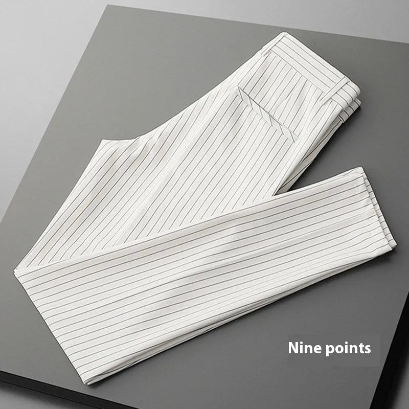Men's thin striped loose suit pants in black and white, showing trousers style and crop jeans options