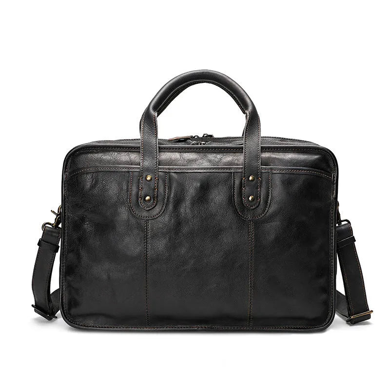 Brown vintage leather men's briefcase showing internal organiser pockets and a shoulder strap.