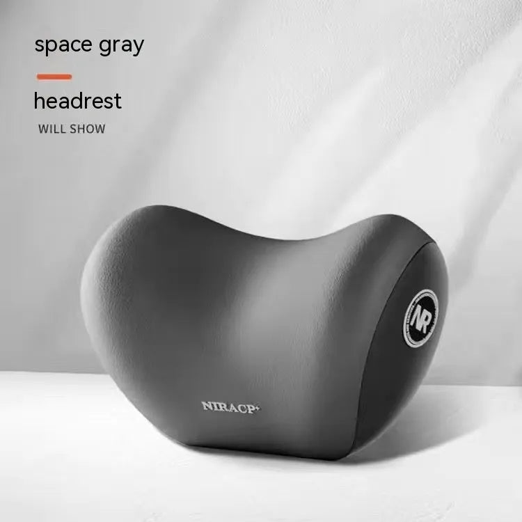 Black memory foam car lumbar support pillow and matching headrest pillow on a car seat.