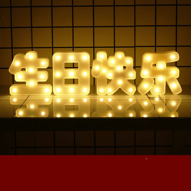 Plastic LED letter light decoration spelling a message, 22cm in height.