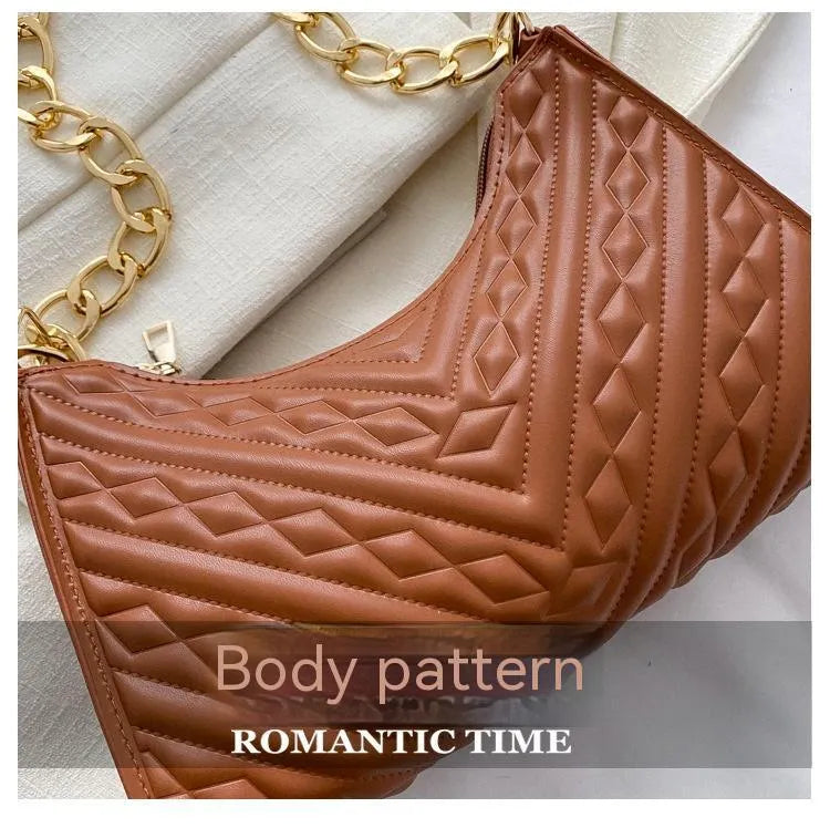 Brown PU pleated chain baguette shoulder bag showing vertical square shape and soft carry handle.