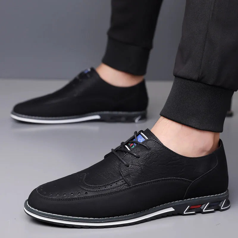Men's black leather slip-on loafer shoe with a rubber sole and visible stitching detail