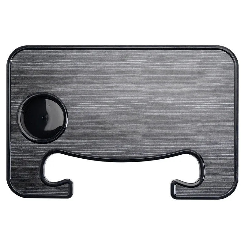 Black ABS plastic car steering wheel laptop stand with foldable design on vehicle dashboard
