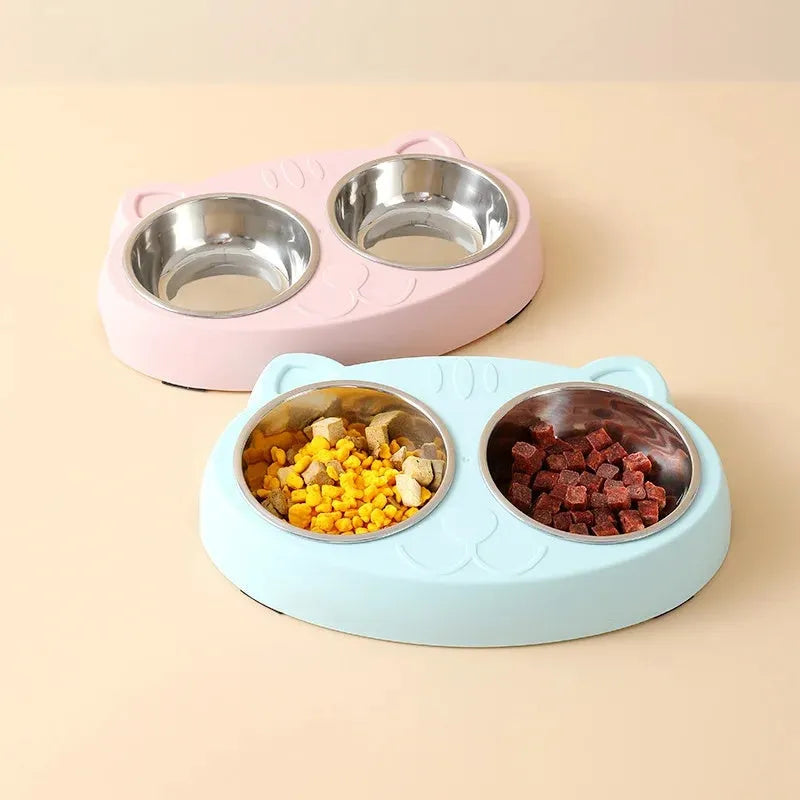 Blue macaron-shaped plastic pet feeder tray with two bowls for cat or dog food and water.