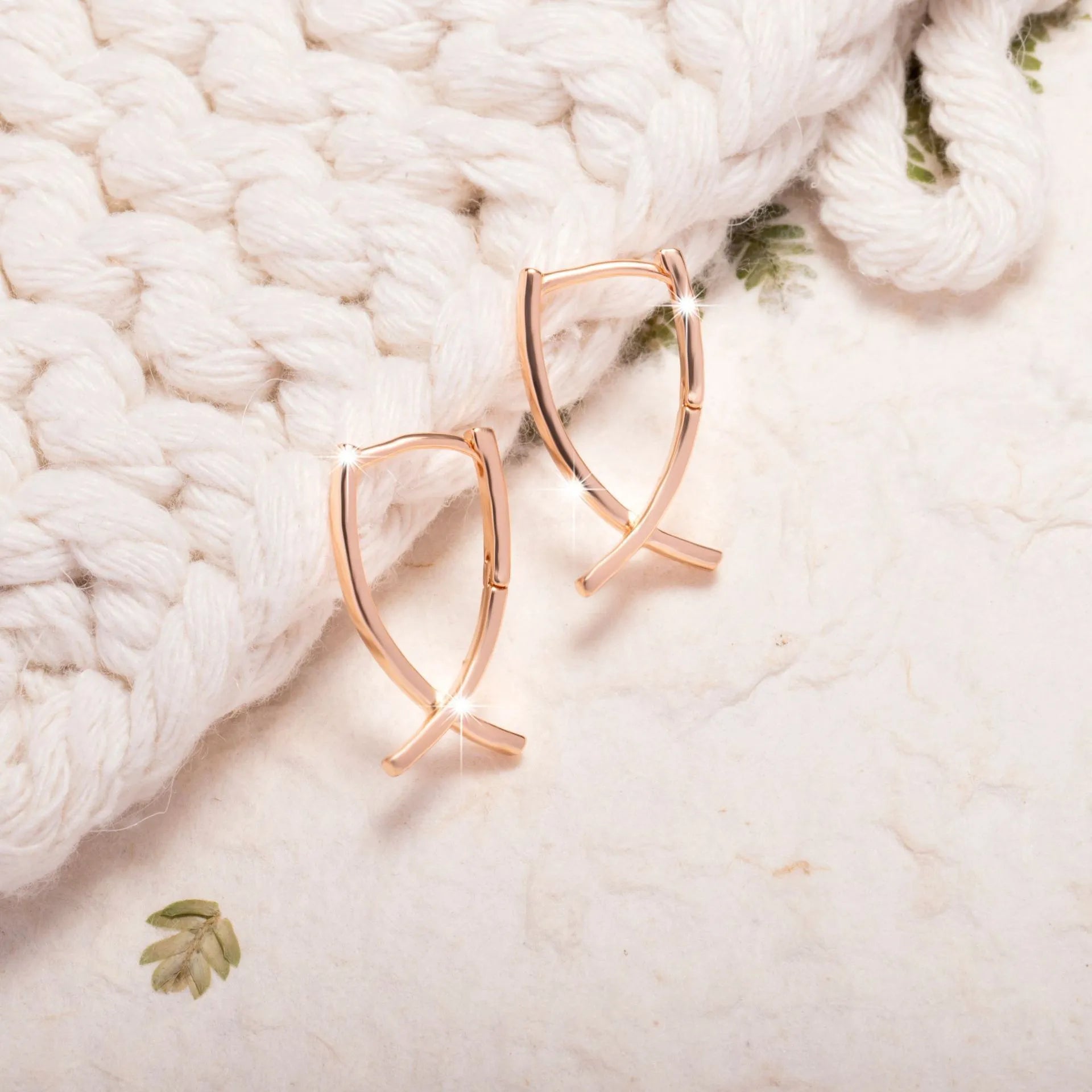 Rose gold copper cross shaped earrings with light luxury aesthetic