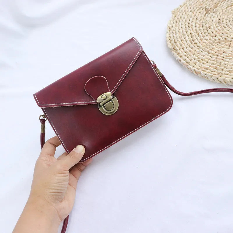 Retro shoulder messenger bag in wine red with flap closure and crossbody strap