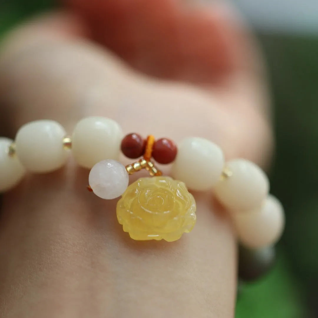 Gradient white jade Bodhi root bracelet with natural beeswax lotus charms, 10mm flower shape