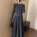 Dark grey knitted two-piece dress suit with 3D pattern, featuring a sweater and skirt in retro ethnic style.