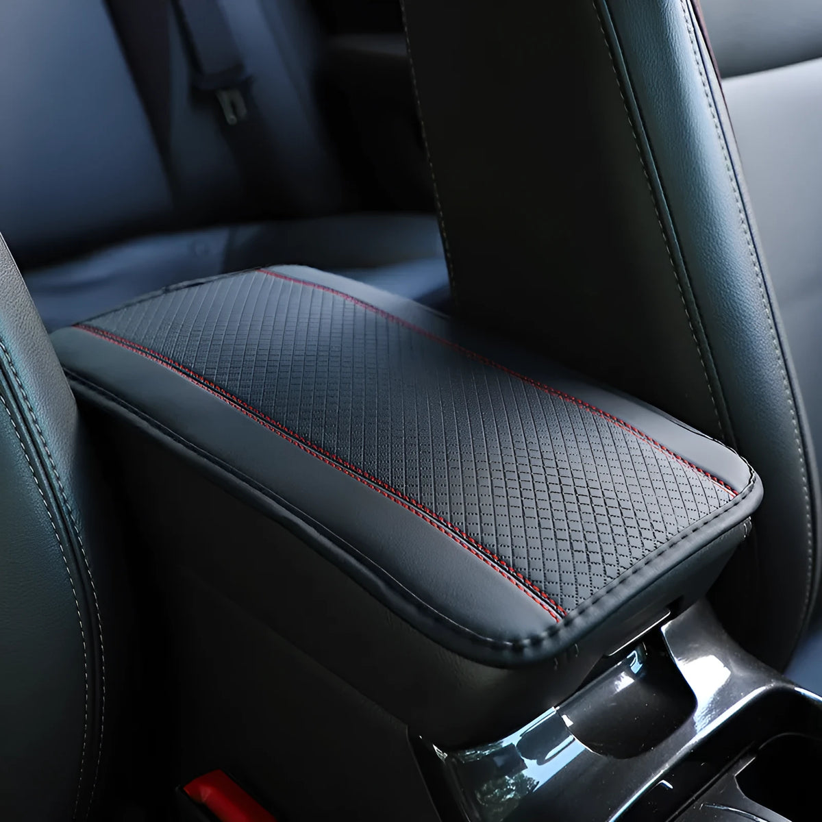 Black embossed PU leather car armrest box cushion mat measuring 32 by 19 centimetres.