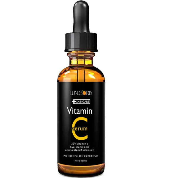 Vitamin C serum set with two 30ml bottles and a white facial beauty device on a clean surface