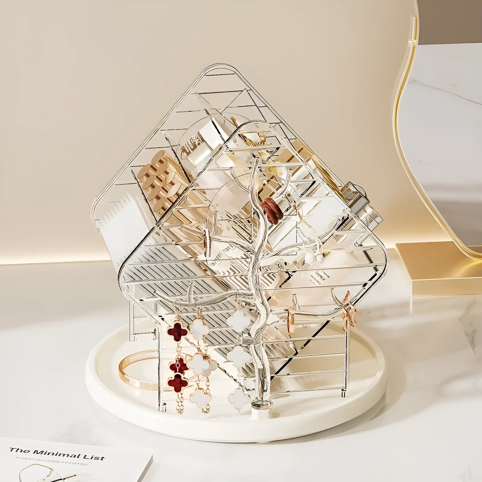 Rotating clear plastic cosmetics storage box with tiered compartments for brushes and bottles.