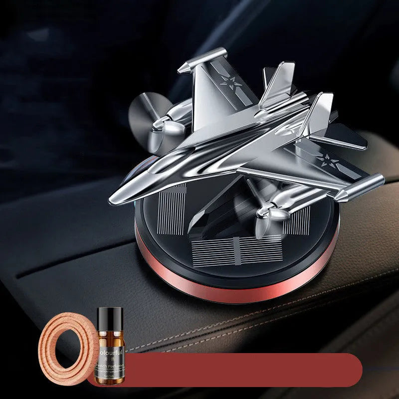 Solar powered rotating fighter jet perfume diffuser in silver with aluminium alloy seat and beech wood wick