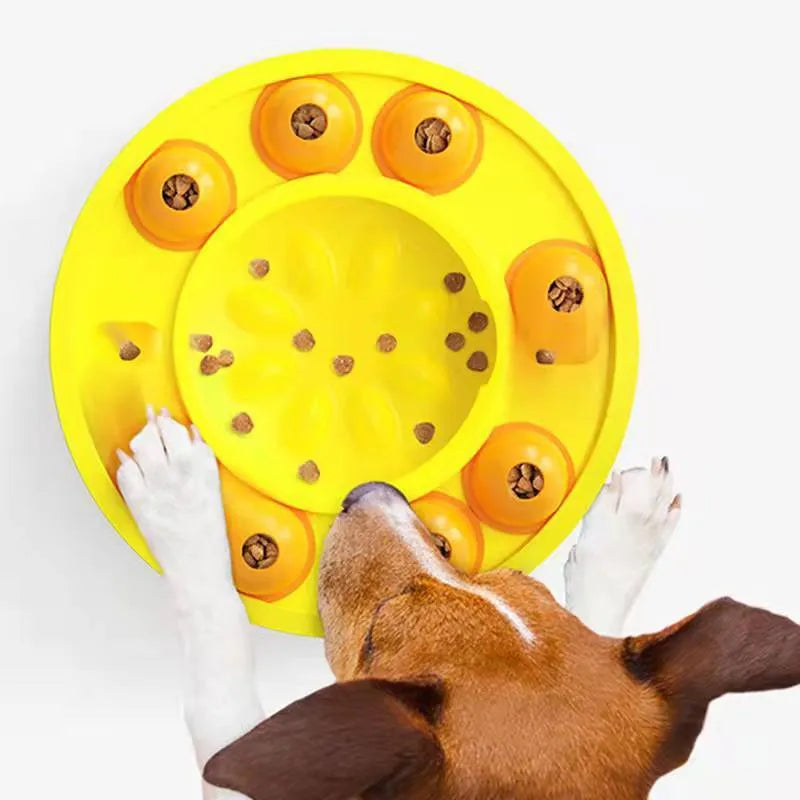 Square blue interactive dog puzzle bowl with a central feeding column and a turntable lid on a wooden floor.