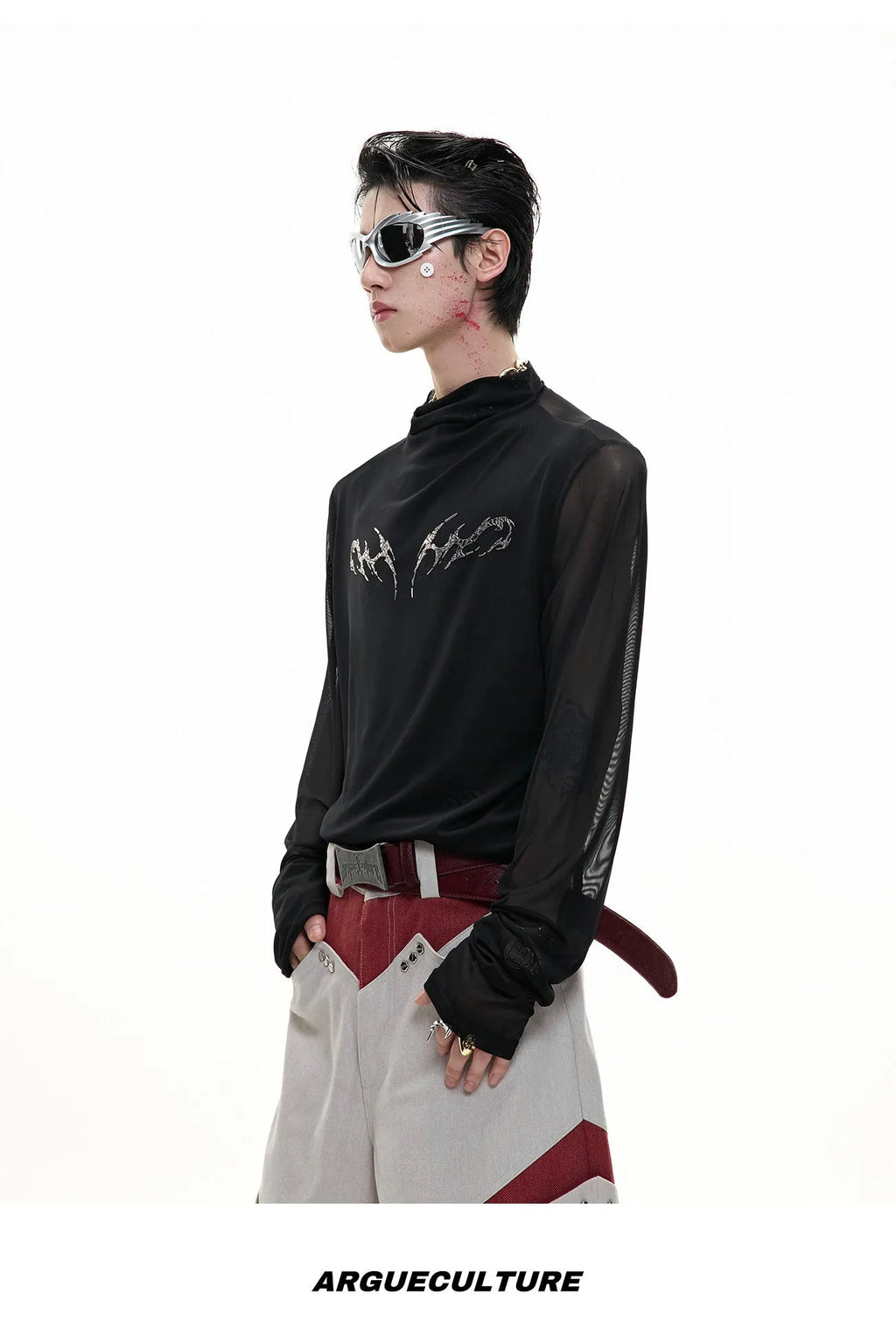 Slim-fit long-sleeved mesh shirt in black, shown as a base layer for athletic wear.