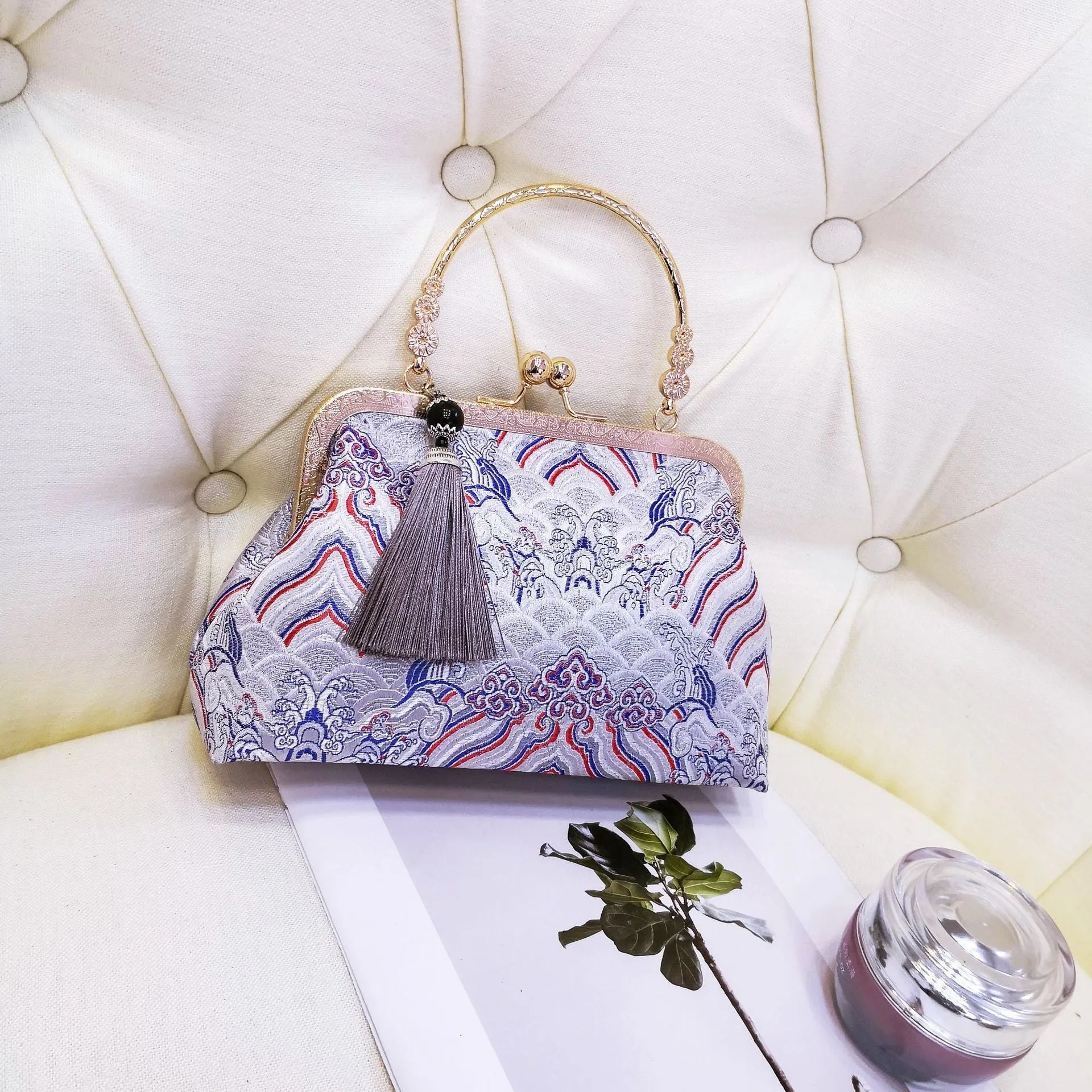 Chinese embroidery cheongsam handbag in polyester with shell shape and internal zipper compartment