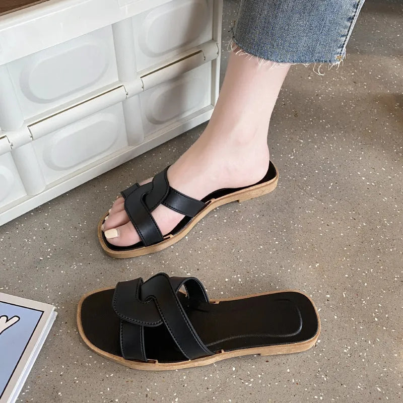 Women's PVC cross strap flip flop sandals in light blue on a white background.